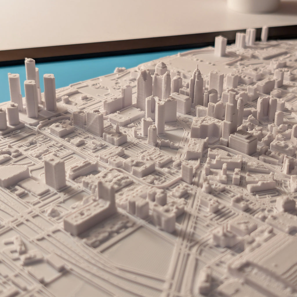 3D model of a cityscape with detailed buildings and roads.