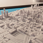 3D model of a cityscape with detailed buildings and roads.