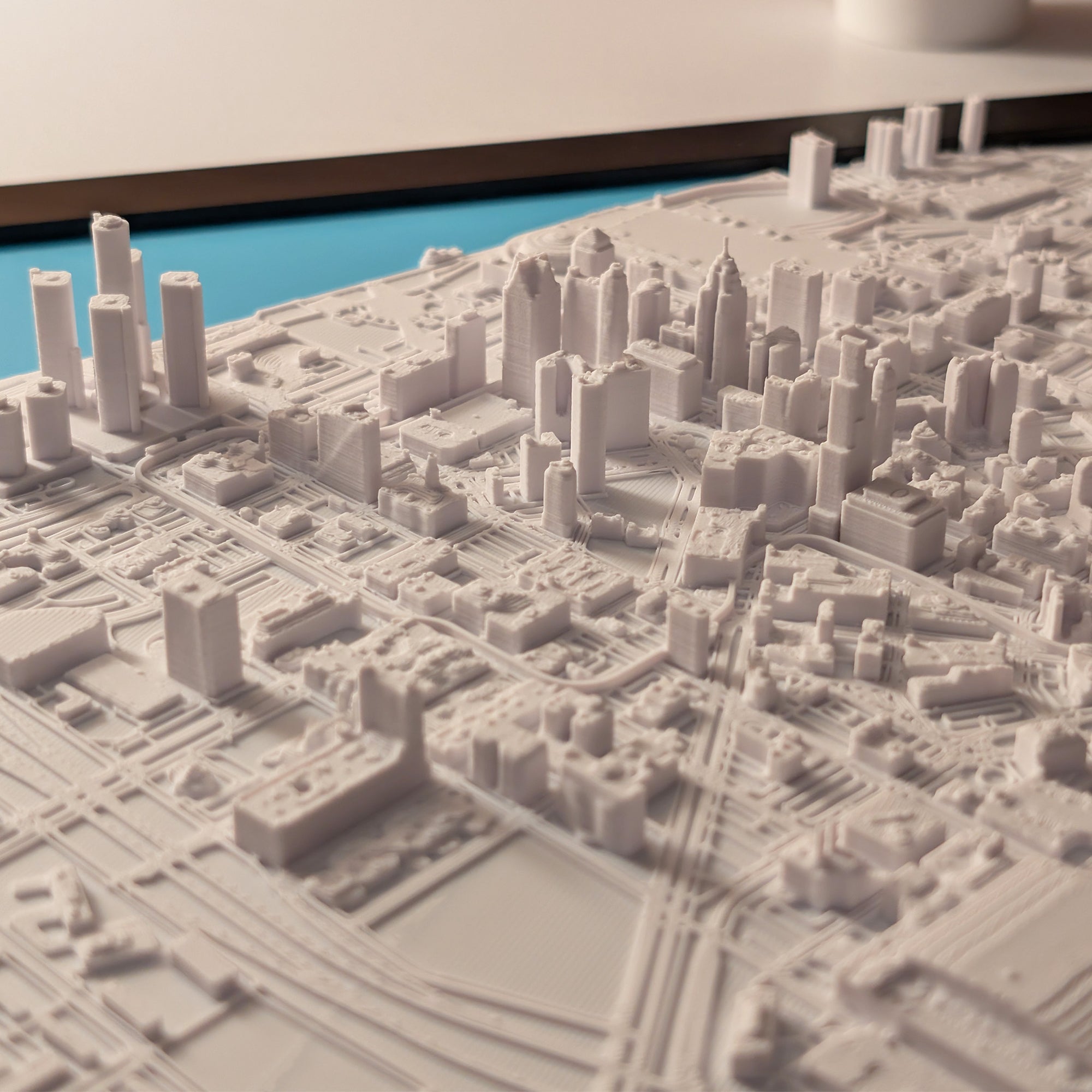 3D model of a cityscape with detailed buildings and roads.