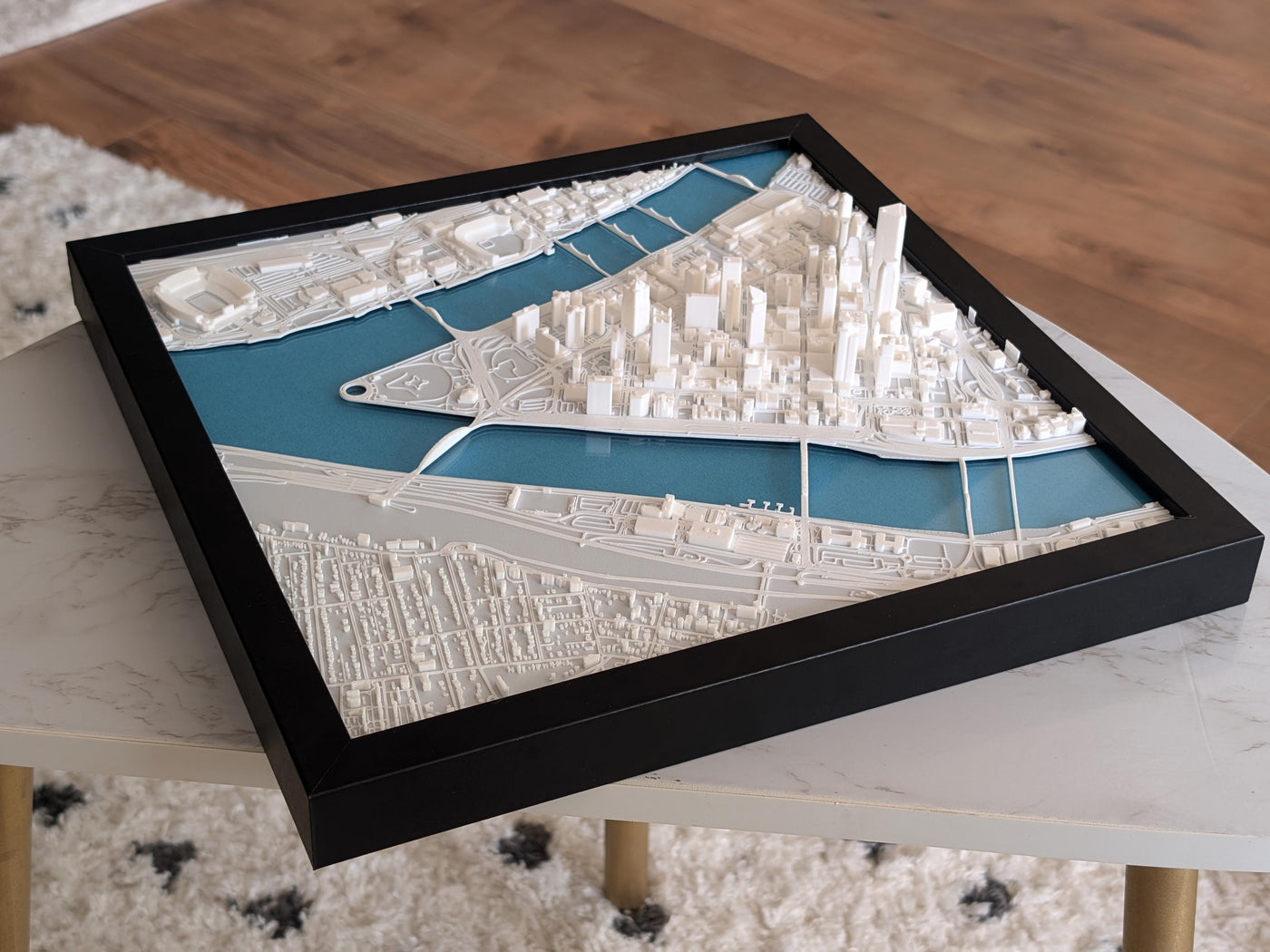 A framed 3D map of Downtown Pittsburgh featuring iconic bridges, historic districts, and modern skyline.